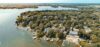 An aerial view of Okauchee Lake, Wisconsin, with piers jutting out from the shore.
